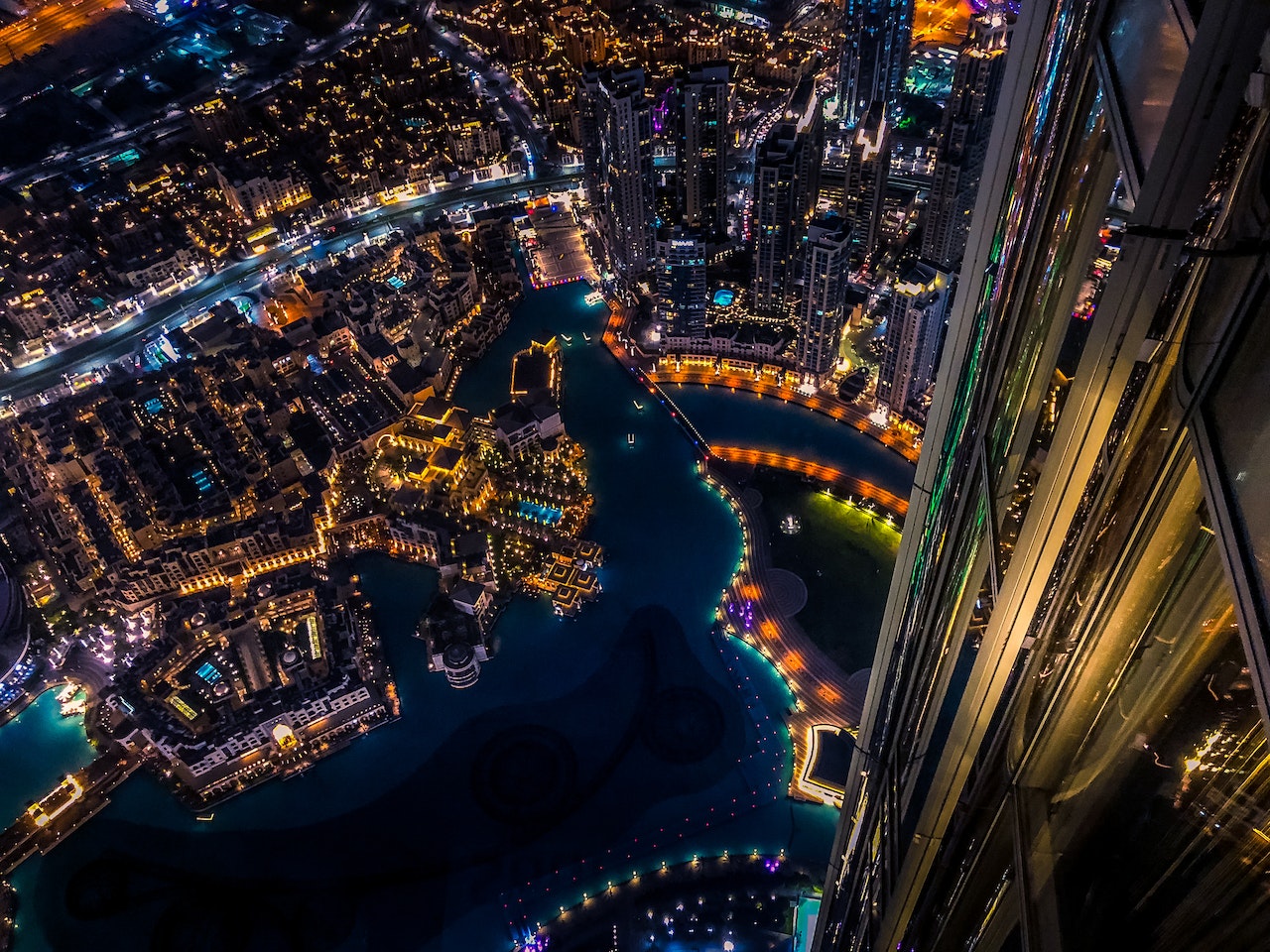 Panoramic view of Dubai's skyline showcasing iconic architectural wonders, including Burj Khalifa, Burj Al Arab, Dubai Marina, Cayan Tower, and more.