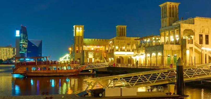 Couple exploring Dubai hidden gems in the Al Seef old town