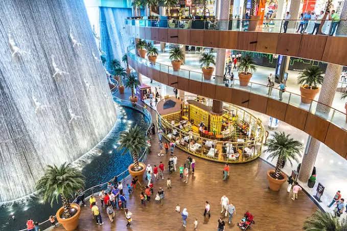 Dubai shopping guide tourists exploring The Dubai Mall interior
