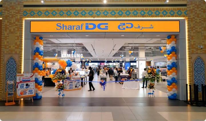 electronics shopping in Dubai at a Sharaf DG store display