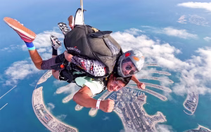 Tandem skydiving instructor and jumper in freefall over Dubai