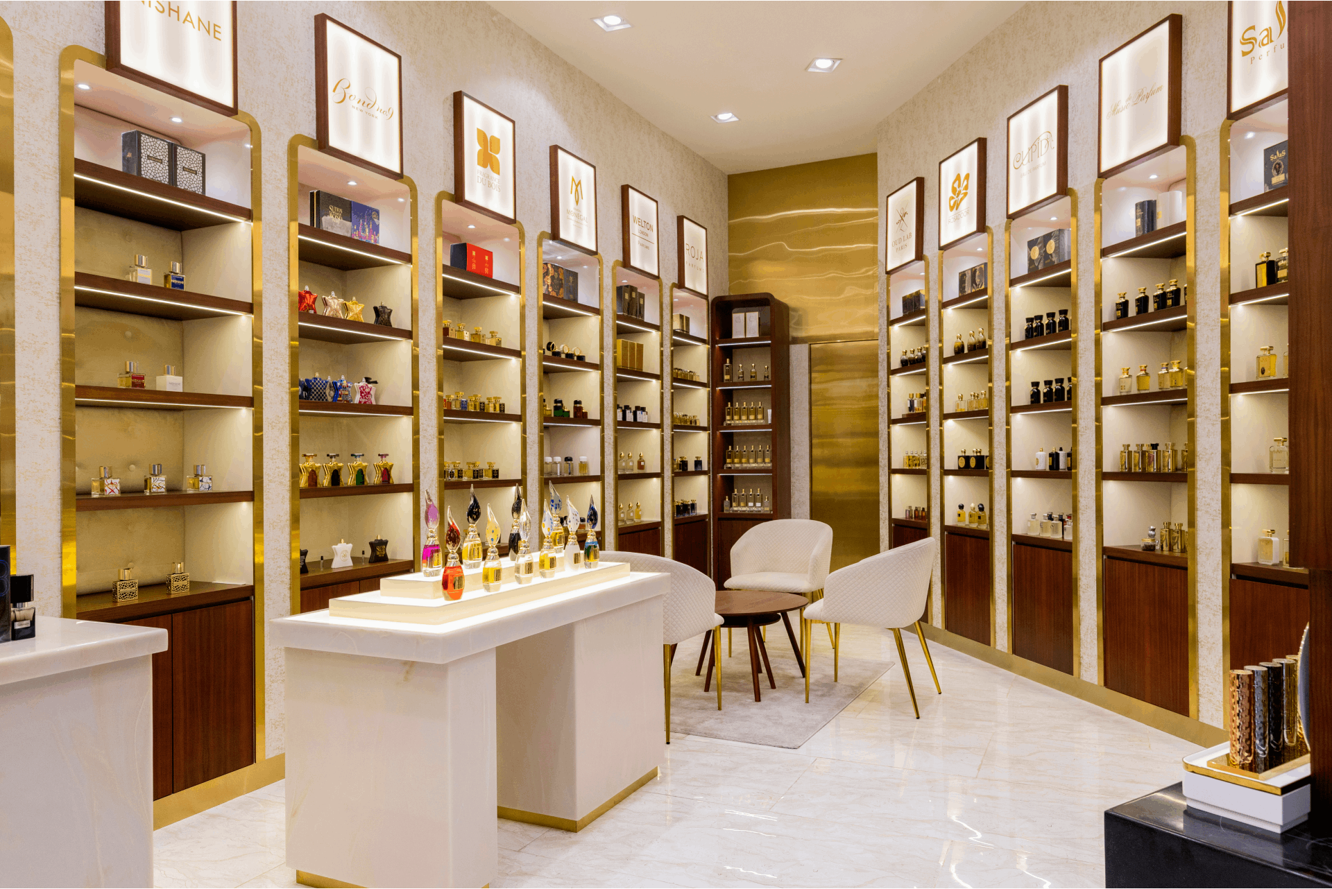 buy perfumes in Dubai – perfume bottles display at Dubai Mall boutique
