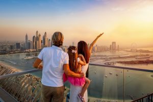 Family activities in Dubai Marina promenade with skyline view